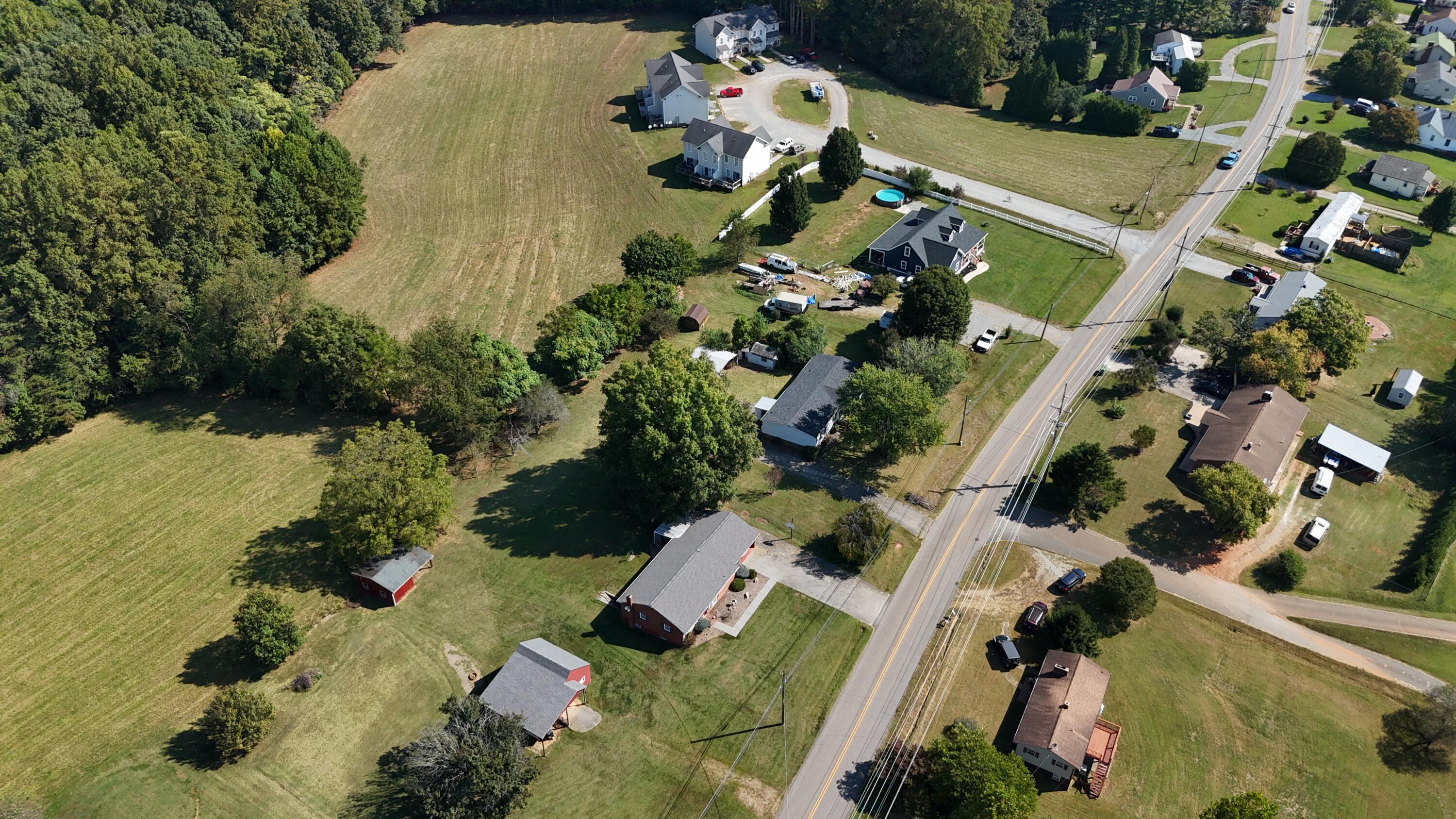 1810 Scuffling Hill Road Rocky Mount, VA 24151 - Photo 36 of 38 an aerial view of a house with a yard and outdoor seating