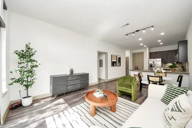 a backyard of a house with barbeque oven table and chairs