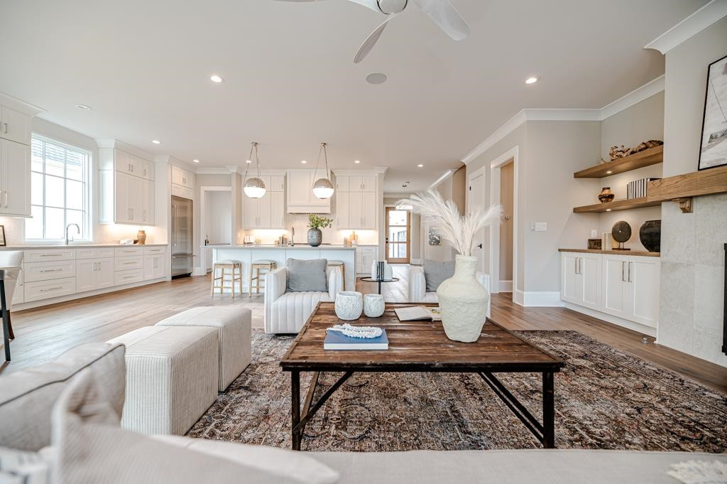 7920 Hardwick Drive Raleigh, NC 27615 - Photo 16 of 53 a living room with furniture a rug and kitchen view