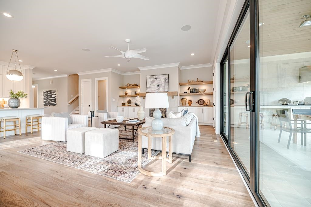 7920 Hardwick Drive Raleigh, NC 27615 - Photo 17 of 53 a living room with lots of white furniture and a table