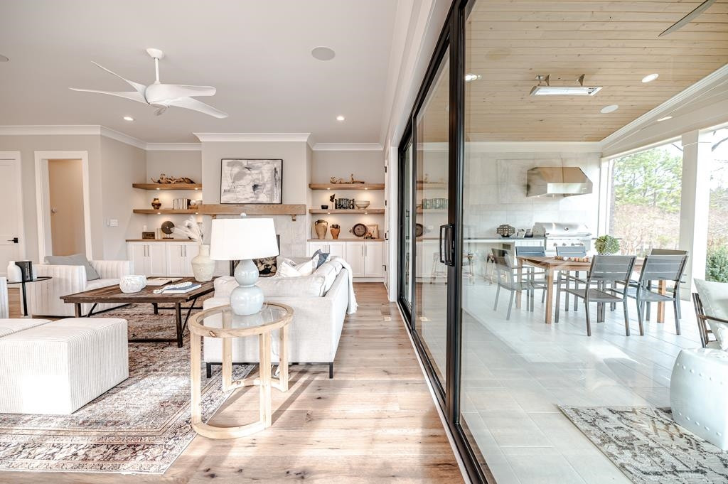 7920 Hardwick Drive Raleigh, NC 27615 - Photo 18 of 53 a living room with lots of furniture and a large window