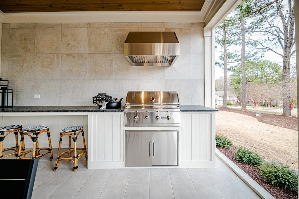 7920 Hardwick Drive Raleigh, NC 27615 - Photo 20 of 53 a kitchen with stainless steel appliances granite countertop a stove a sink and a microwave