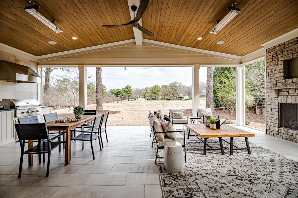 7920 Hardwick Drive Raleigh, NC 27615 - Photo 21 of 53 a dining room with furniture and a floor to ceiling window
