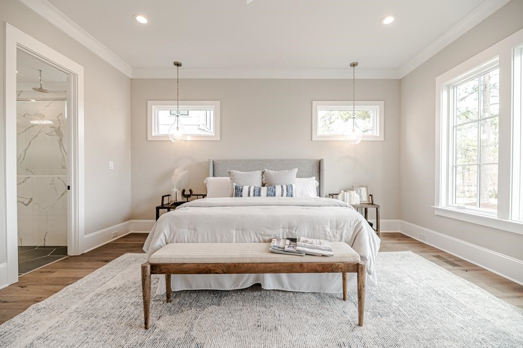 7920 Hardwick Drive Raleigh, NC 27615 - Photo 24 of 53 a bedroom with a bed and a window