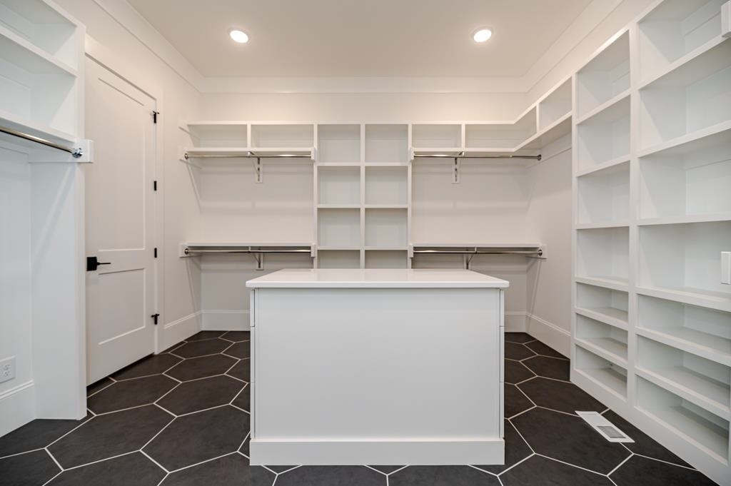 7920 Hardwick Drive Raleigh, NC 27615 - Photo 25 of 53 a utility room with cabinets