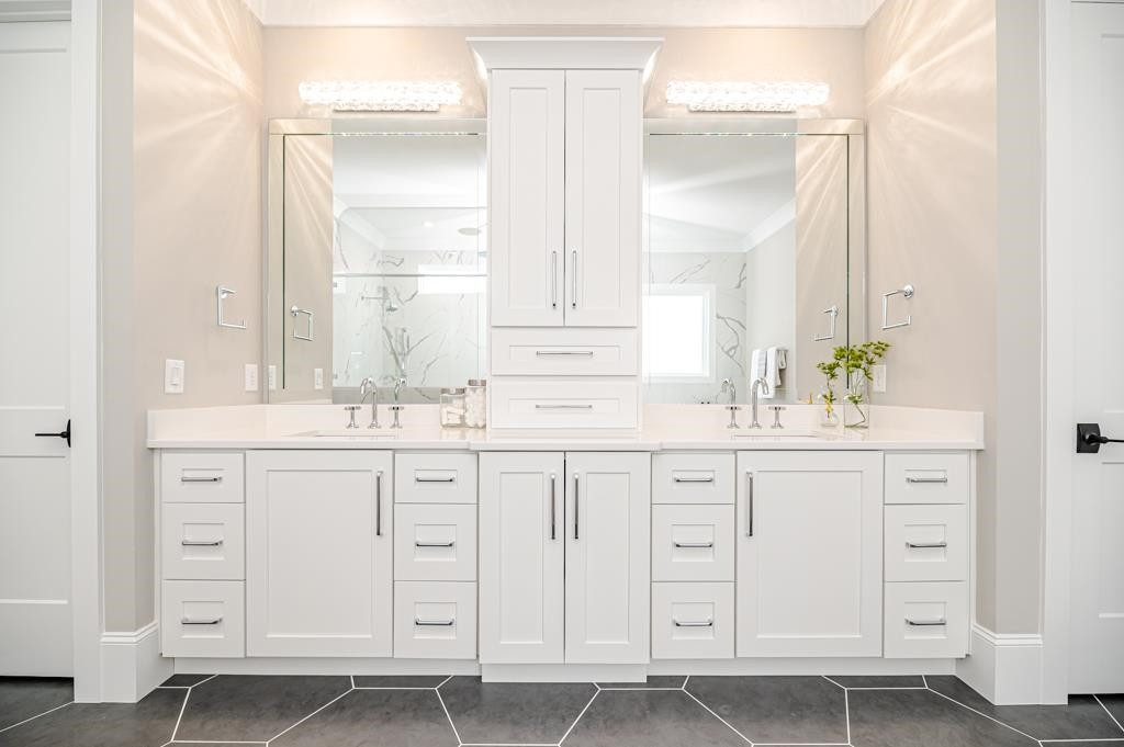 7920 Hardwick Drive Raleigh, NC 27615 - Photo 27 of 53 a bathroom with white cabinets and a sink