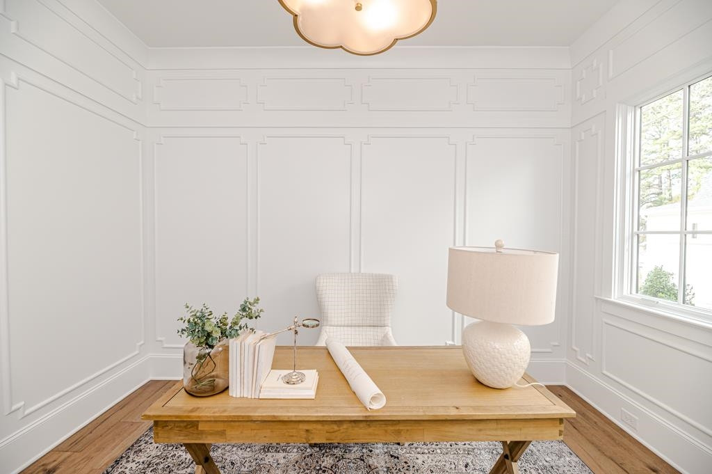 7920 Hardwick Drive Raleigh, NC 27615 - Photo 33 of 53 a living room with furniture and a potted plant