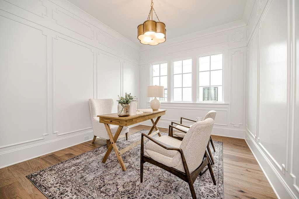 7920 Hardwick Drive Raleigh, NC 27615 - Photo 34 of 53 a workspace room with furniture and wooden floor