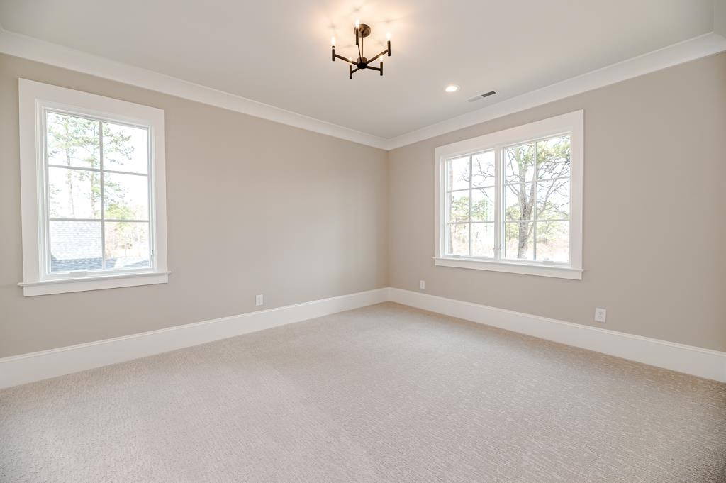 7920 Hardwick Drive Raleigh, NC 27615 - Photo 37 of 53 wooden floor in an empty room with a window