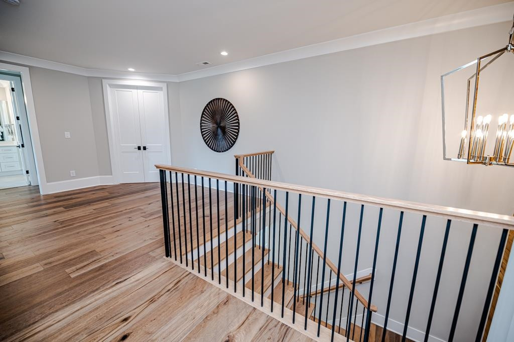 7920 Hardwick Drive Raleigh, NC 27615 - Photo 39 of 53 a view of a hallway with wooden floor