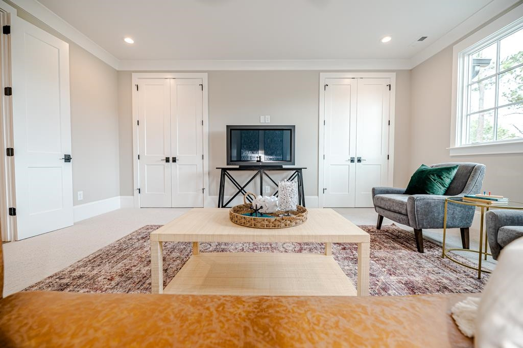 7920 Hardwick Drive Raleigh, NC 27615 - Photo 41 of 53 a living room with furniture and a flat screen tv