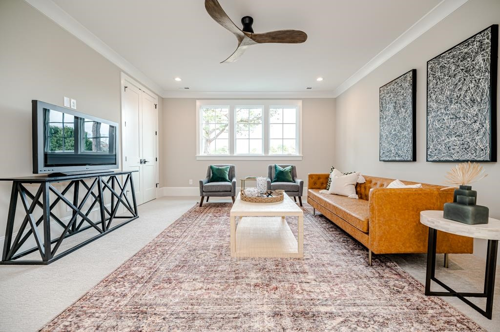 7920 Hardwick Drive Raleigh, NC 27615 - Photo 42 of 53 a living room with furniture and a flat screen tv