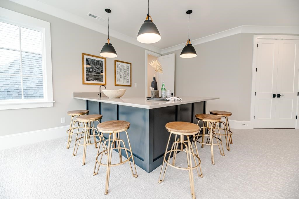 7920 Hardwick Drive Raleigh, NC 27615 - Photo 44 of 53 a view of a dining room with furniture and wooden floor