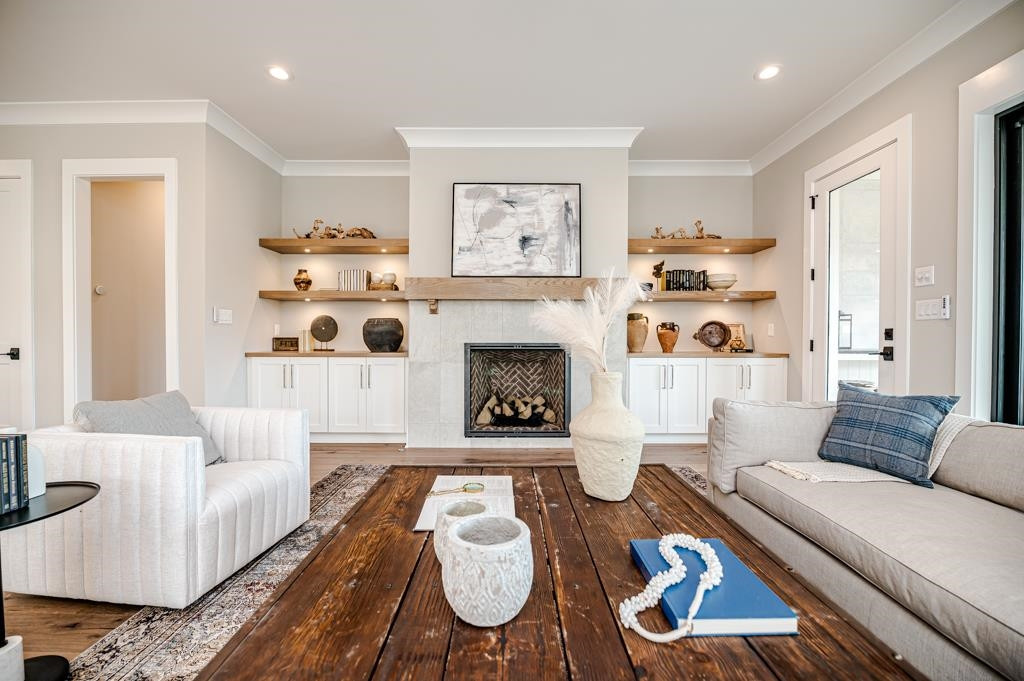 7920 Hardwick Drive Raleigh, NC 27615 - Photo 7 of 53 a living room with furniture and a fireplace