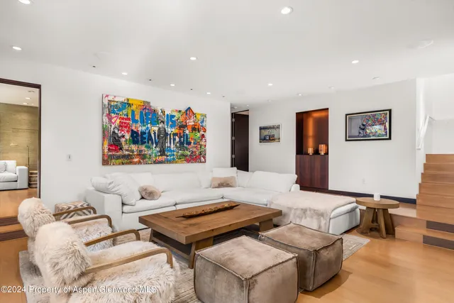 a kitchen with stainless steel appliances granite countertop a refrigerator a sink and a stove