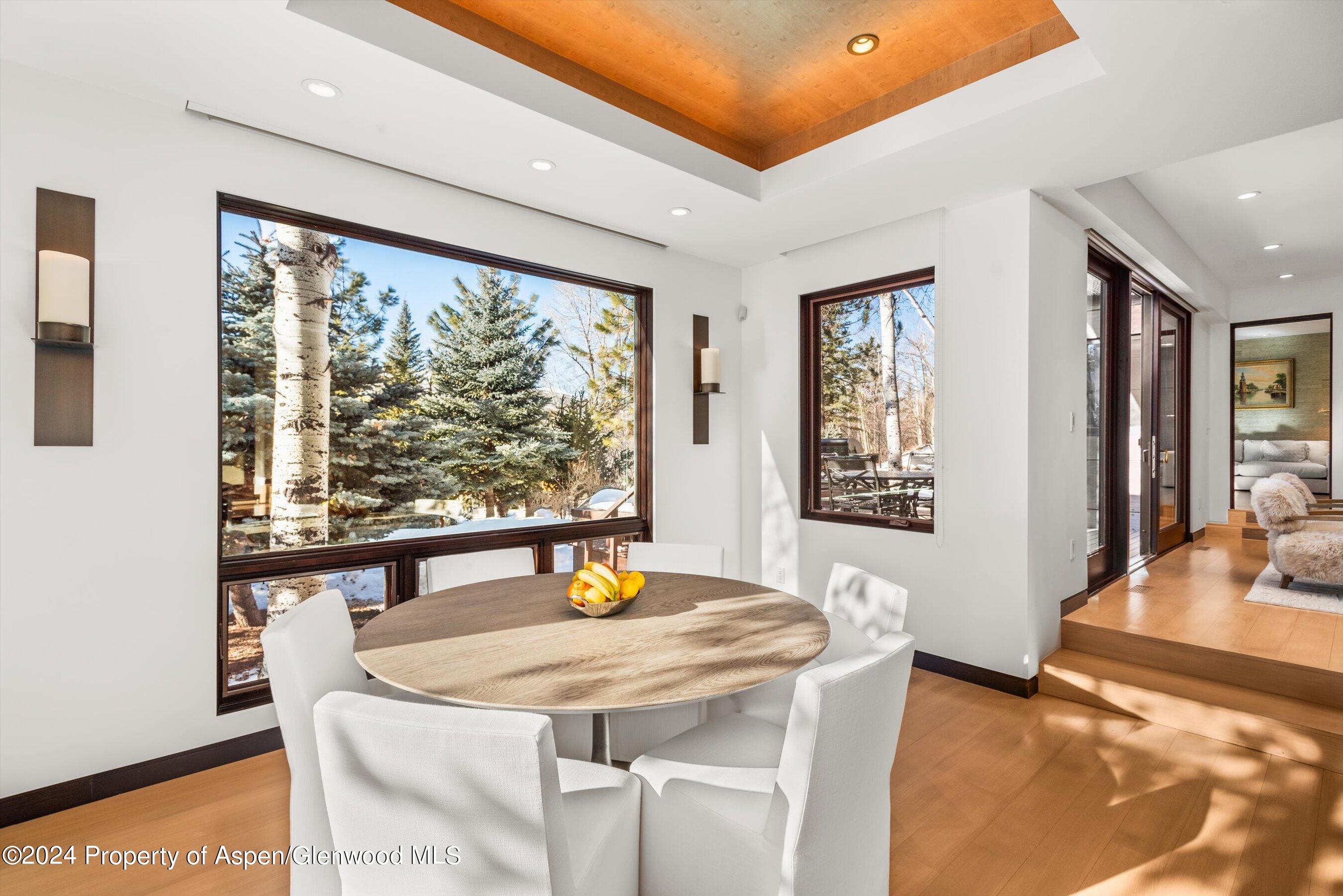 25 Nighthawk Drive Aspen, CO 81611 - Photo 14 of 34 a view of a dining room with furniture and wooden floor