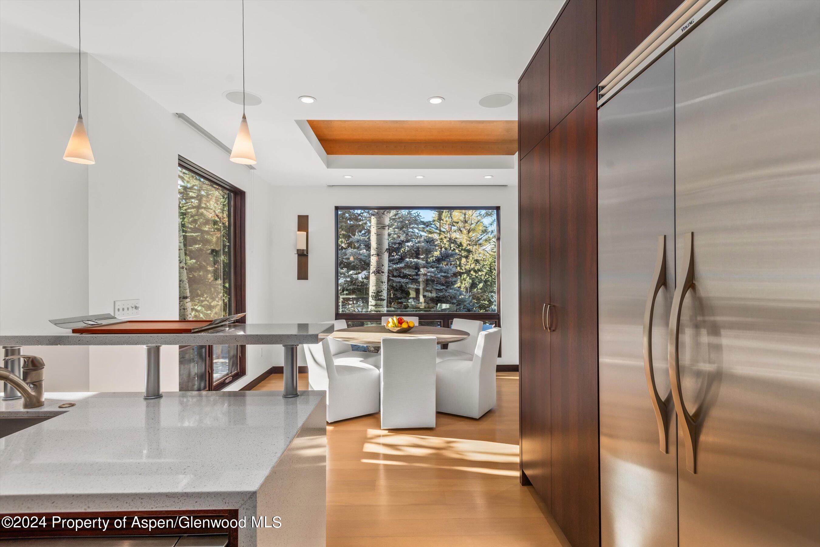 25 Nighthawk Drive Aspen, CO 81611 - Photo 15 of 34 a kitchen with stainless steel appliances granite countertop a refrigerator a sink and a stove