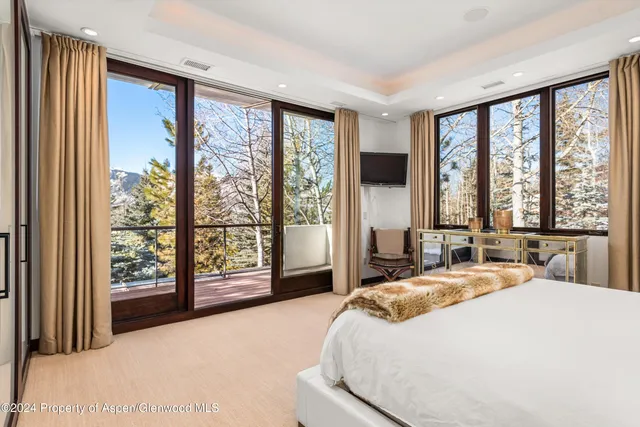 a view of a balcony with wooden fence and floor