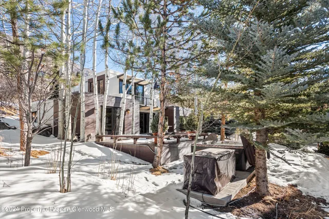 a view of a building with cars park