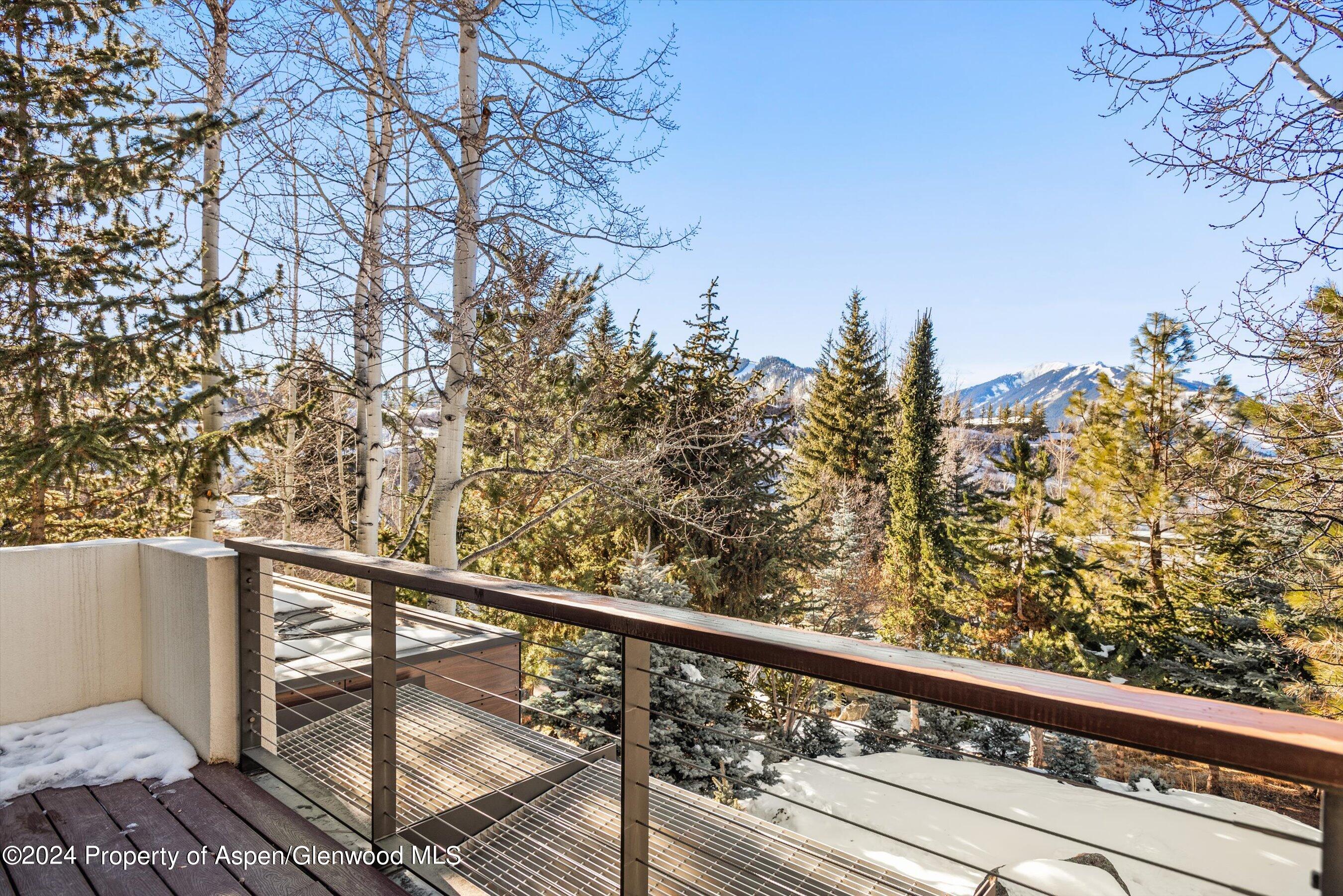 25 Nighthawk Drive Aspen, CO 81611 - Photo 22 of 34 a view of a balcony with wooden fence and floor