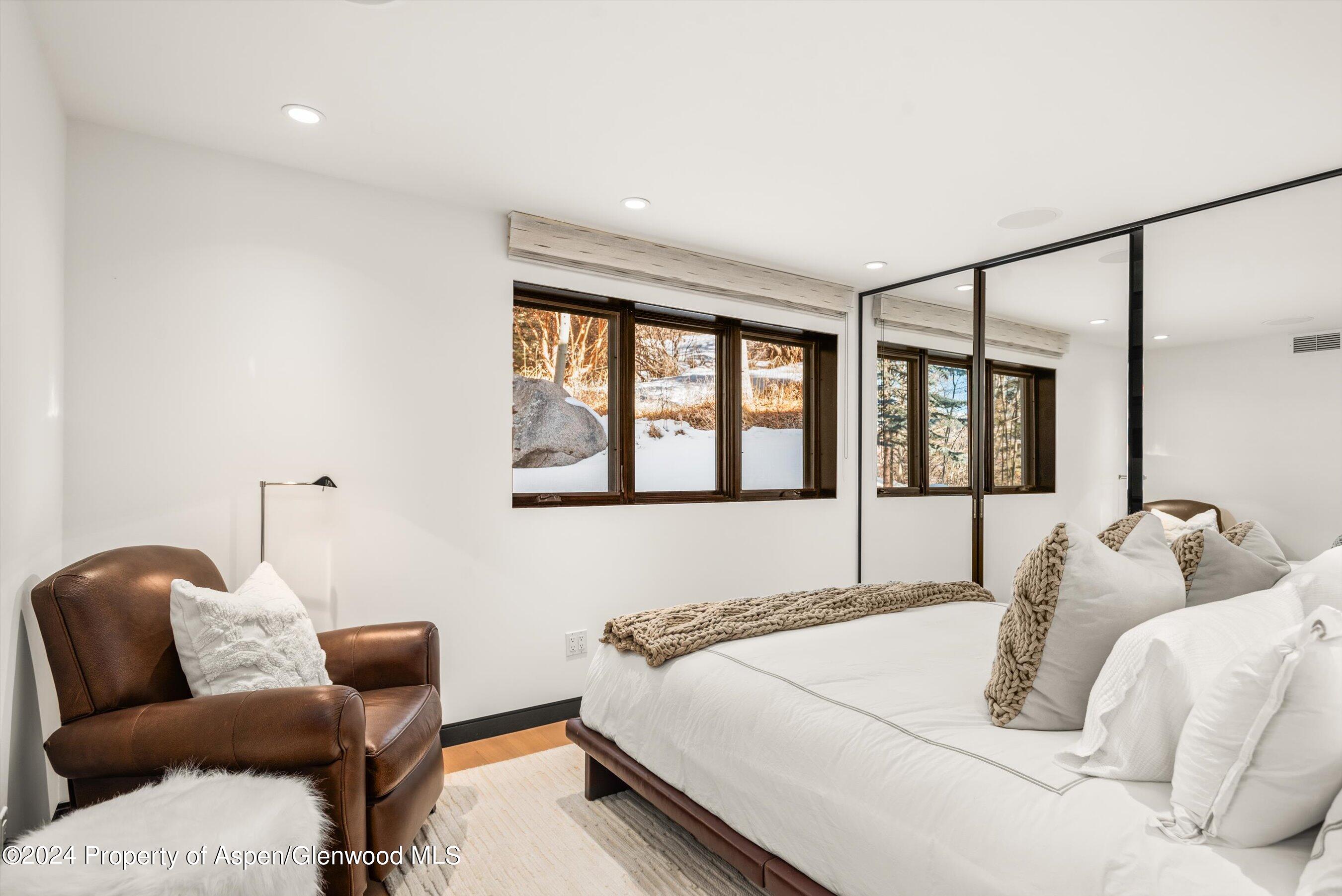 25 Nighthawk Drive Aspen, CO 81611 - Photo 30 of 34 a bedroom with bed and a window