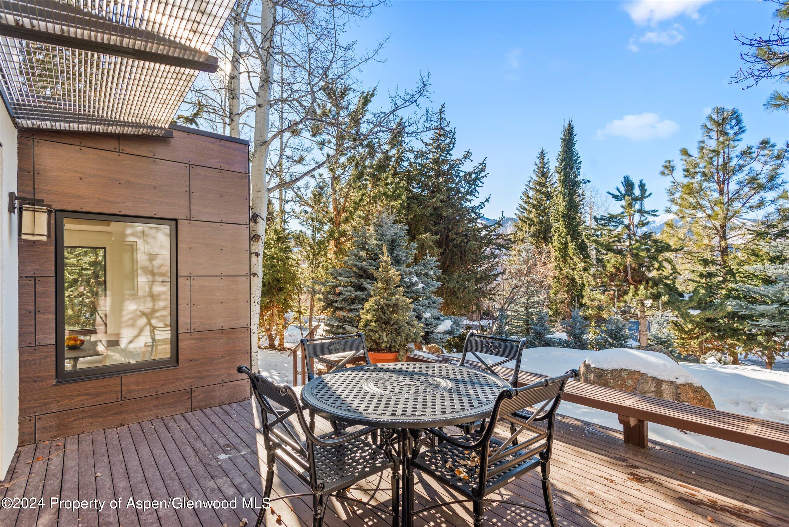 25 Nighthawk Drive Aspen, CO 81611 - Photo 4 of 34 a view of a chairs and table on the balcony