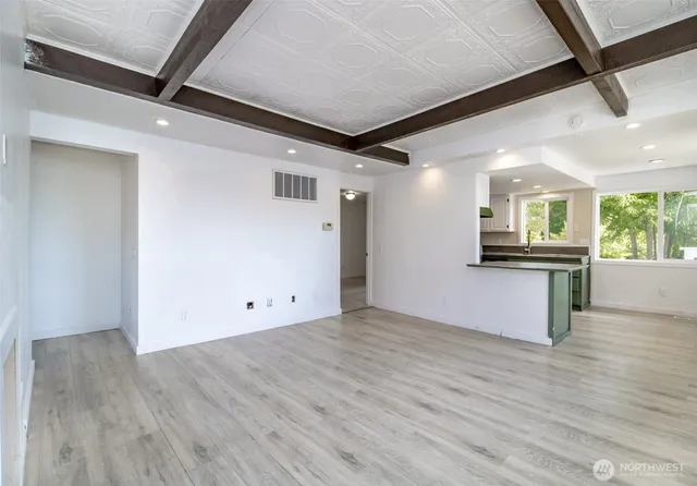 a view of a kitchen with a sink and a microwave