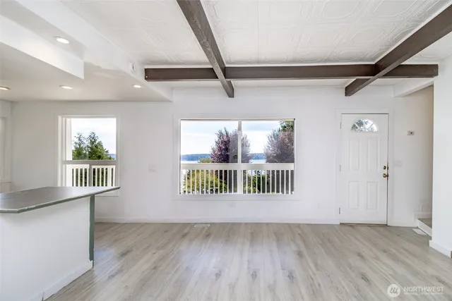 a view of an empty room and a window