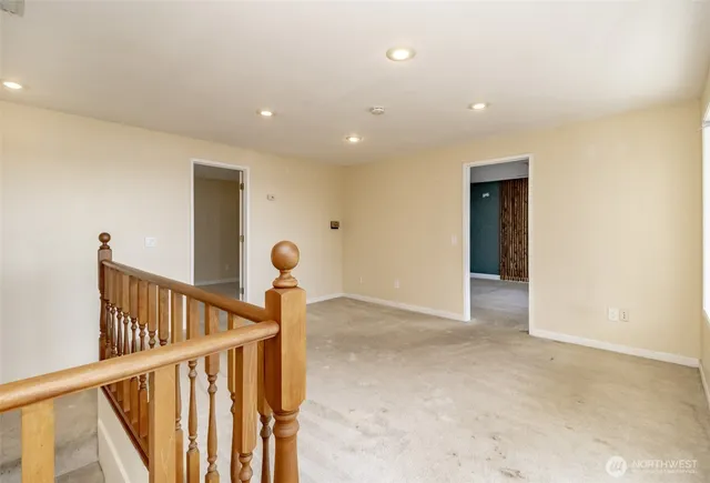 a view of an entryway with wooden floor