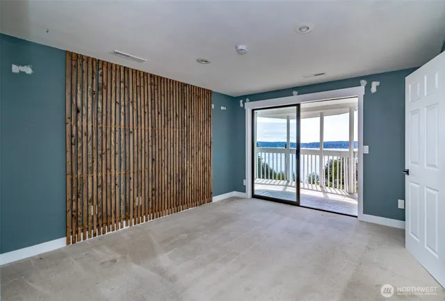 a view of an empty room with a sliding door