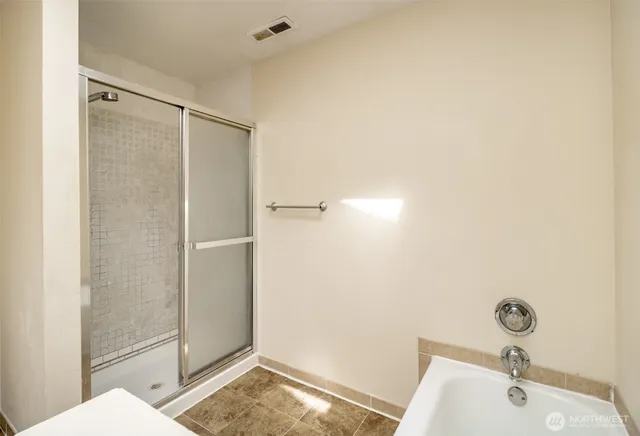 a bathroom with a sink and shower