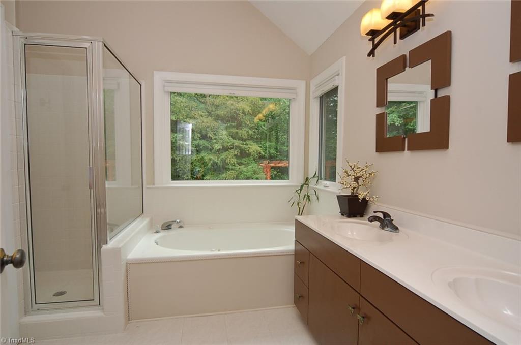 1400 Whites Mill Road High Point, NC 27265 - Photo 20 of 30 Master bathroom also has a walk in shower and a vaulted ceiling