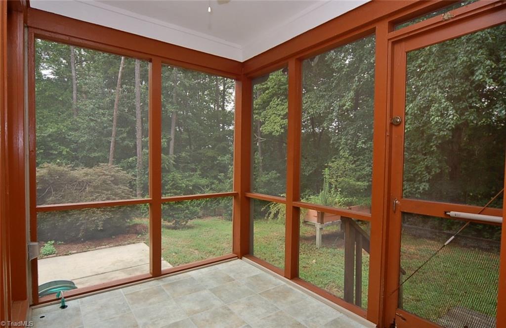 1400 Whites Mill Road High Point, NC 27265 - Photo 26 of 30 Screened porch overlooks the private fenced backyard and the patio space.