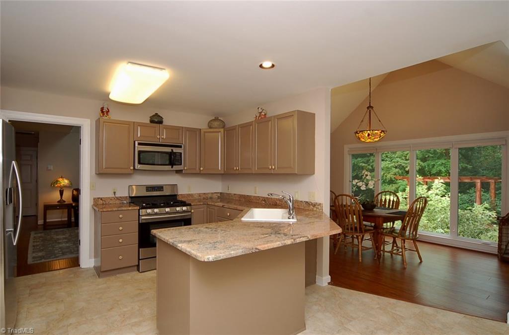 1400 Whites Mill Road High Point, NC 27265 - Photo 6 of 30 Beautiful granite countertops. Wrap-around breakfast bar