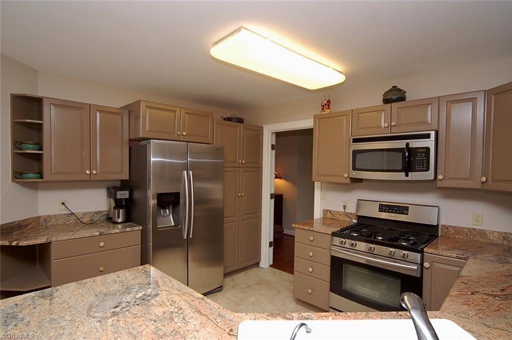 1400 Whites Mill Road High Point, NC 27265 - Photo 7 of 30 Stainless steel appliances with a Samsung 5 burner gas stove and a Samsung side by side refrigerator with ice maker new in 2016.