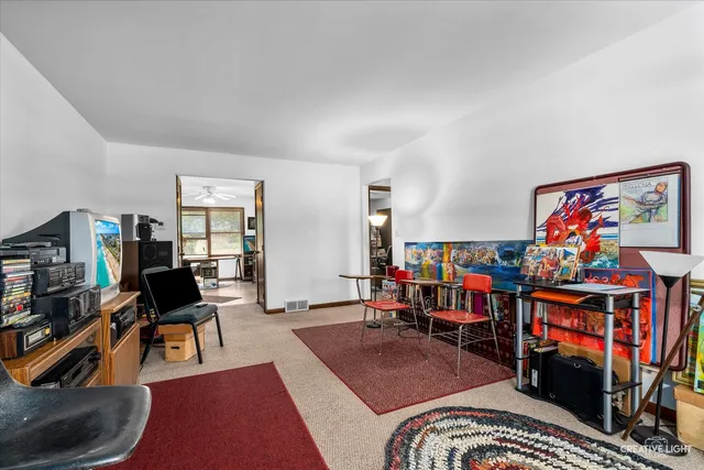 a living room with lots of furniture and a wooden floor