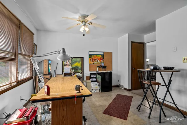 a view of a livingroom with furniture and a flat screen tv