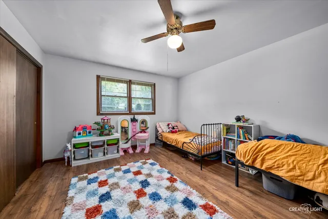 a bedroom with bed and a window