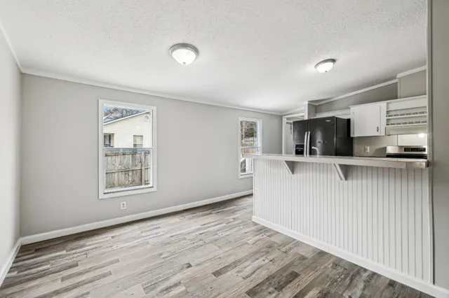 a view of a kitchen from the hallway