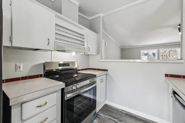 a kitchen with a stove and a microwave