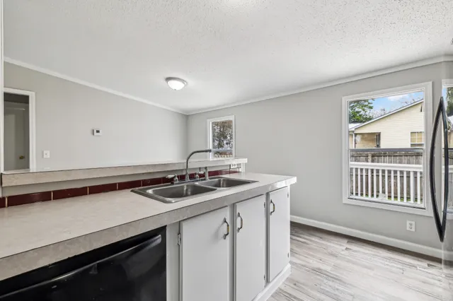 a kitchen with a sink and a window