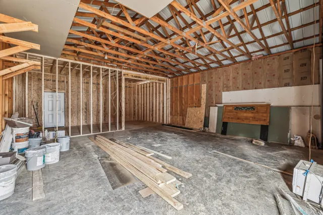 a view of an empty room with a fireplace