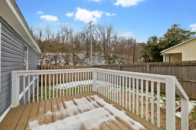 a view of a two chairs and table in the balcony