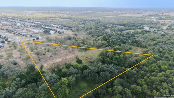 an aerial view of mountain with trees
