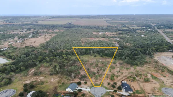 an aerial view of residential house with outdoor space