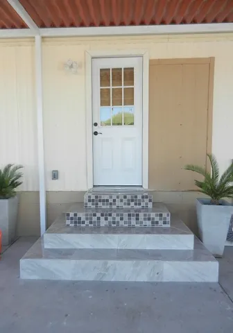 a dining table chair next to a window