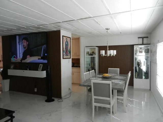 a bedroom with a bed a desk and chair