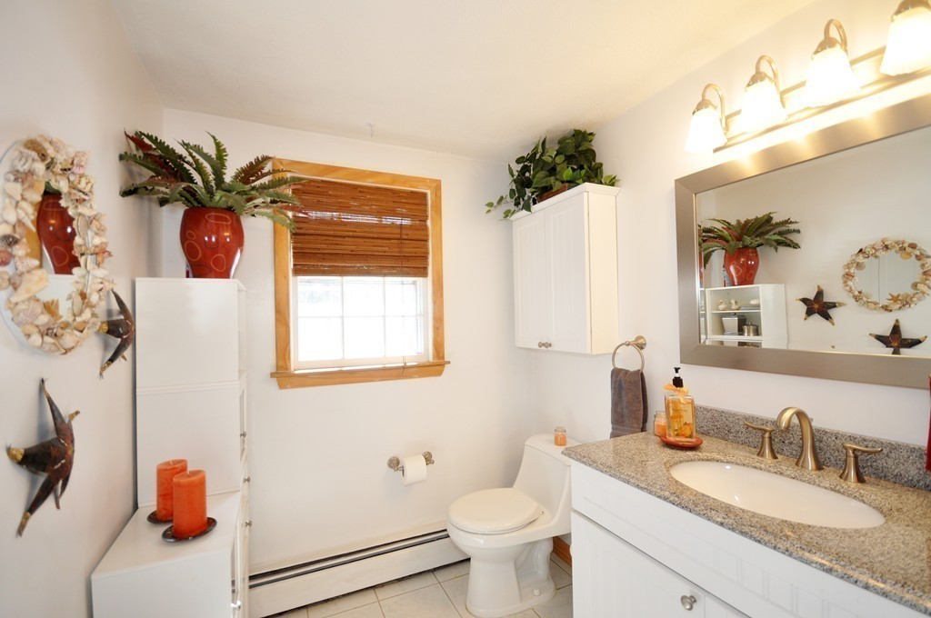 174 Hudson Road Stow, MA 01775 - Photo 12 of 29 a bathroom with a granite countertop sink and a mirror