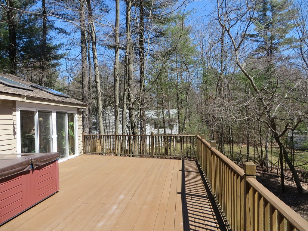 174 Hudson Road Stow, MA 01775 - Photo 24 of 29 a view of a house with backyard and deck
