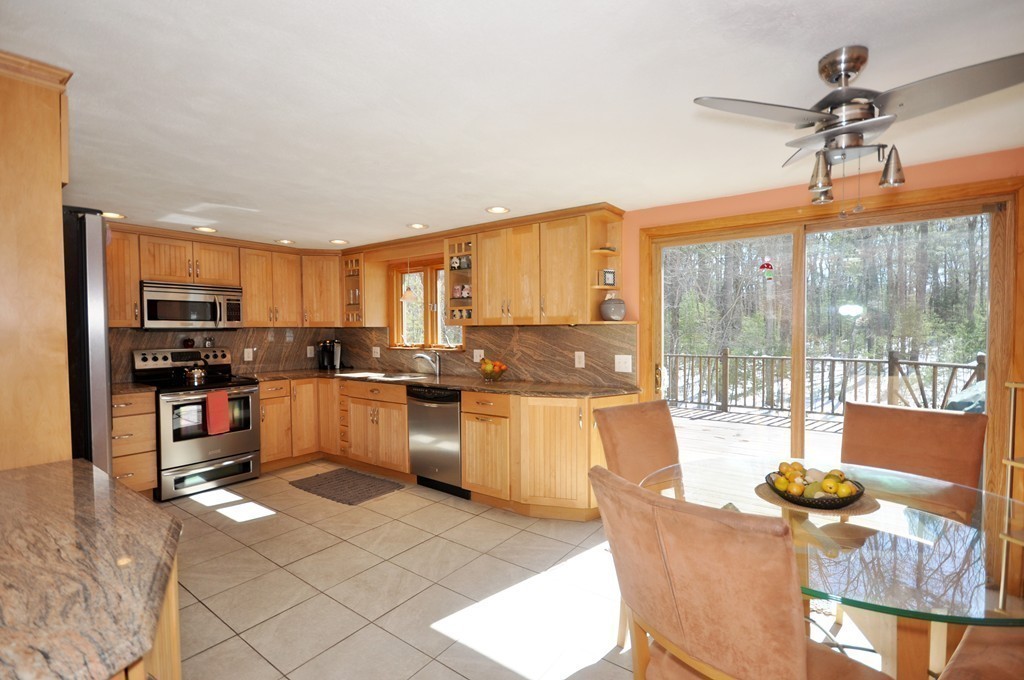 174 Hudson Road Stow, MA 01775 - Photo 5 of 29 a large kitchen with lots of counter space windows and appliances